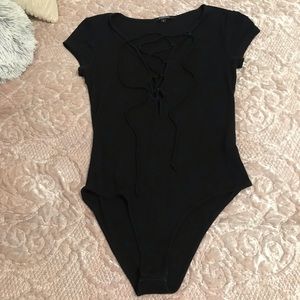 Tops - Black Lace Up Bodysuit. Stretchy. Size Small. Tops - Black Lace Up Bodysuit. Stretchy. Size Small.